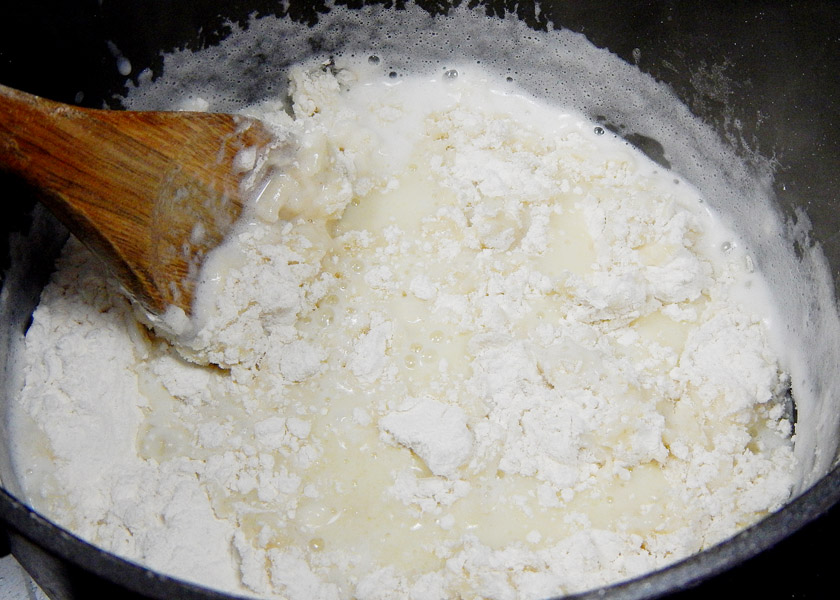 Adding flour to Pate a Choux