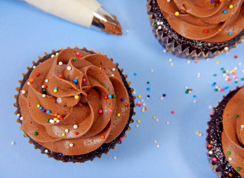 Chocolate Cupcakes with chocolate frosting and rainbow sprinkles