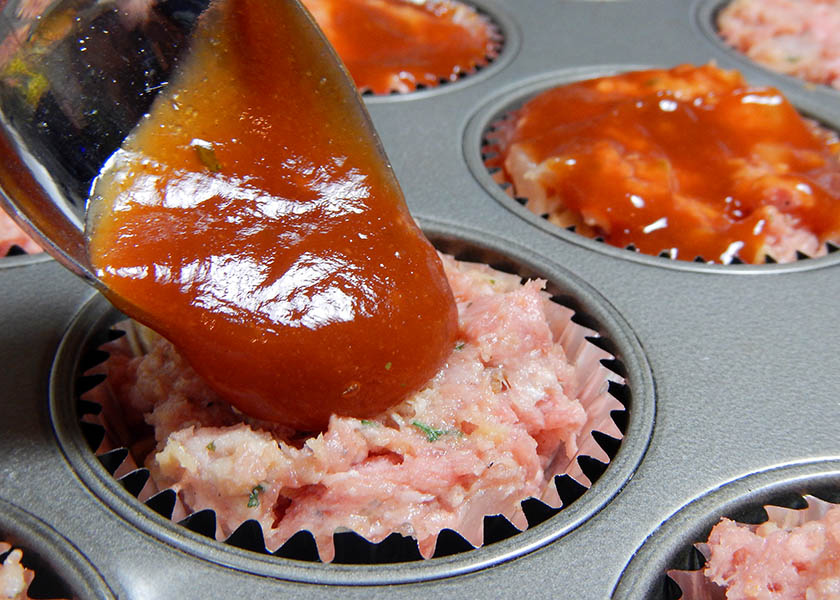 Putting Ketchup on Meatloaf Cupcakes