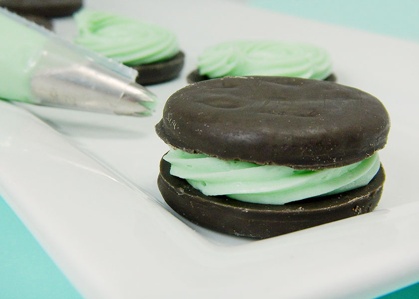 A Thin Mint Cookie Sandwich Stuffed with Mint Cheesecake