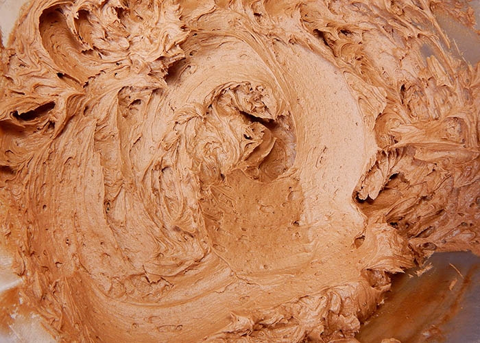 A bowl of whipped chocolate frosting 